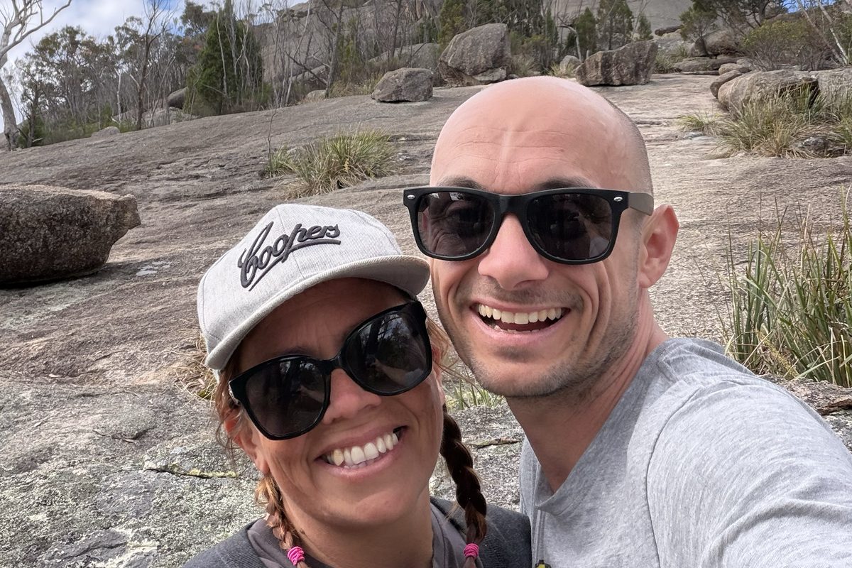 Wayne and Ingrid in front of a big granite rock