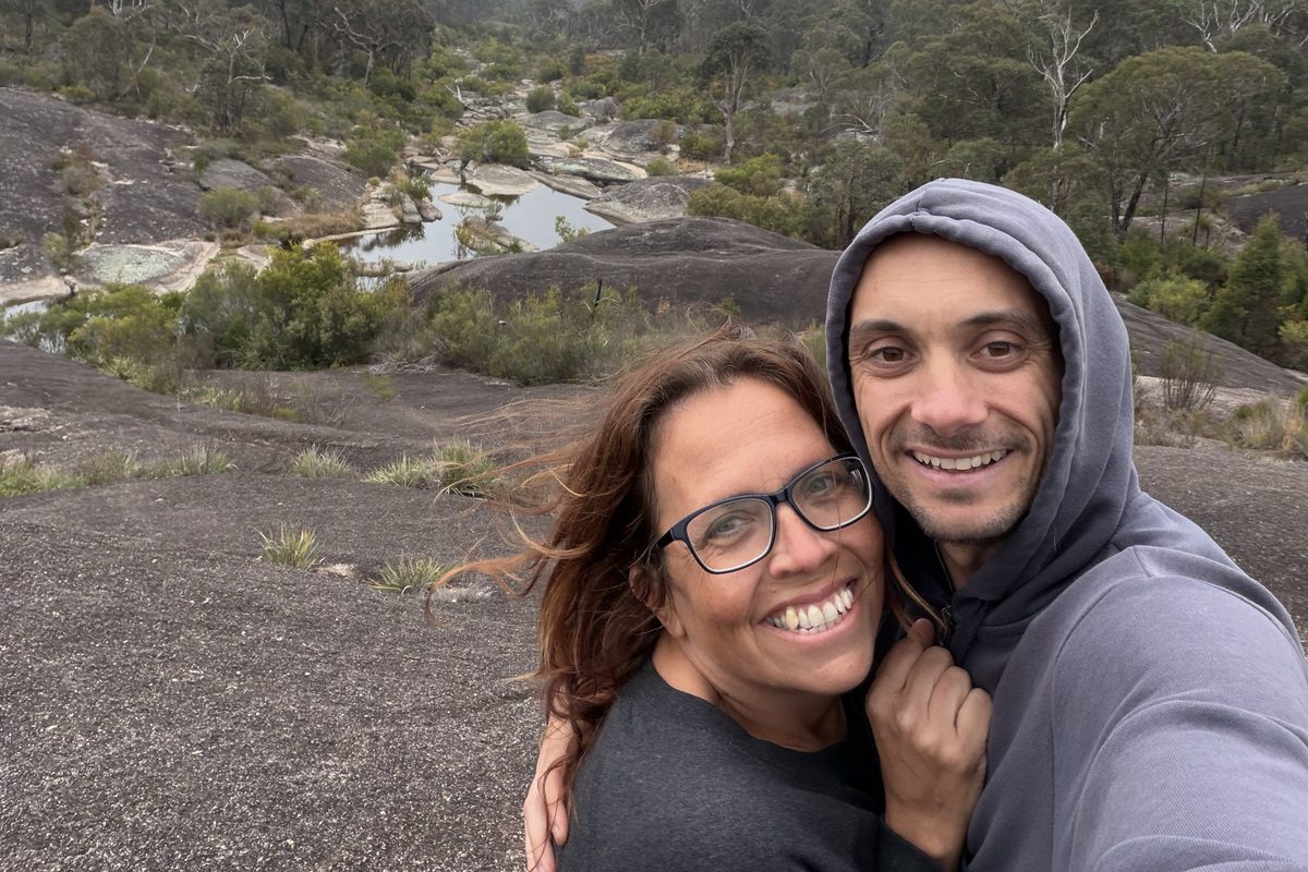 Wayne and Ingrid on a cloudy bush walk above a creek