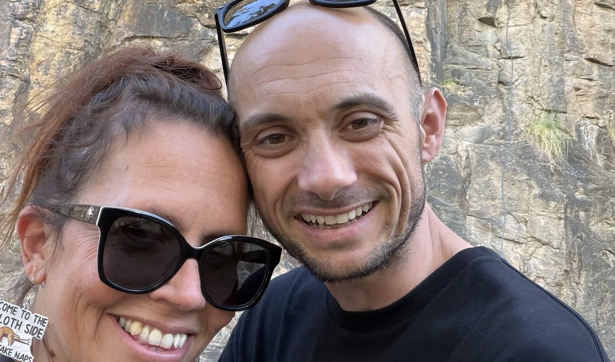 Wayne and Ingrid in front of a rock wall